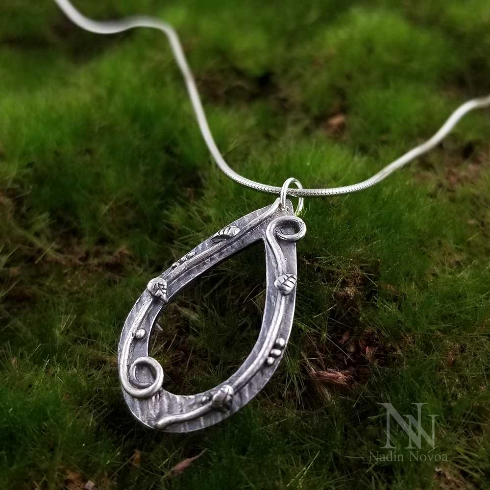 Lightweight teardrop pendant in fine silver. Nadin